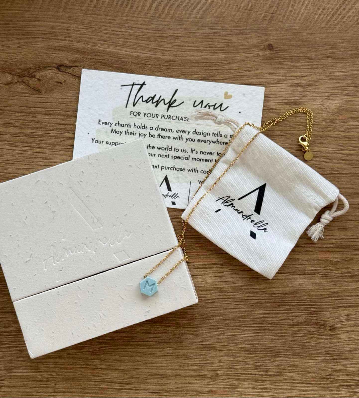 Handmade porcelain summer minimalist necklace with letter pendant, presented in an eco-friendly Almundrella gift box.