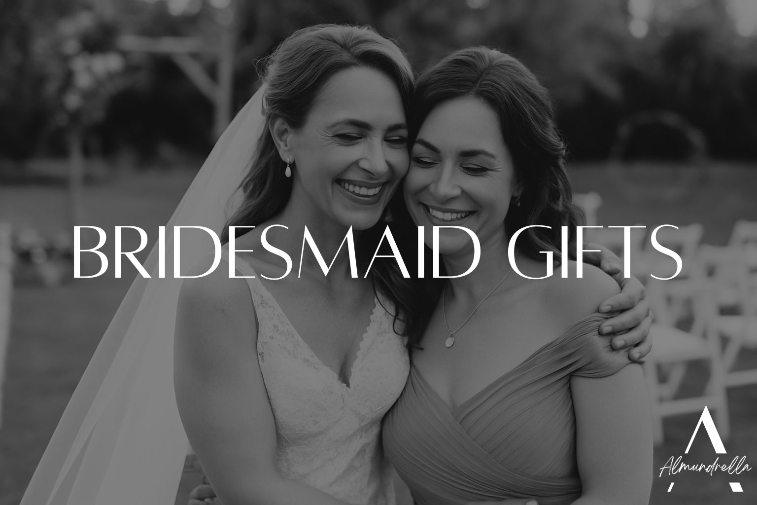 Bride and bridesmaid hugging and smiling outdoors at a summer wedding, symbolizing friendship and gratitude